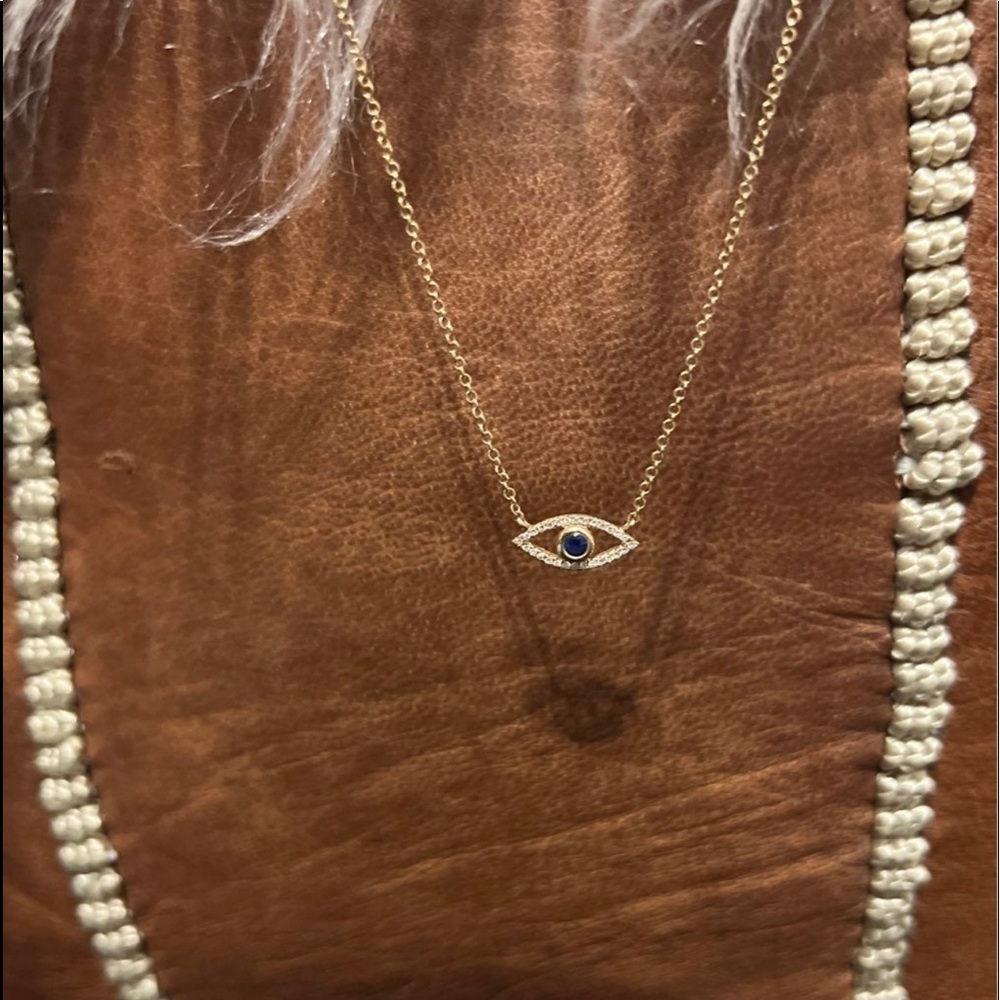 SOLD 14k rose gold eye of protection.   Diamond Pave with Sapphire.